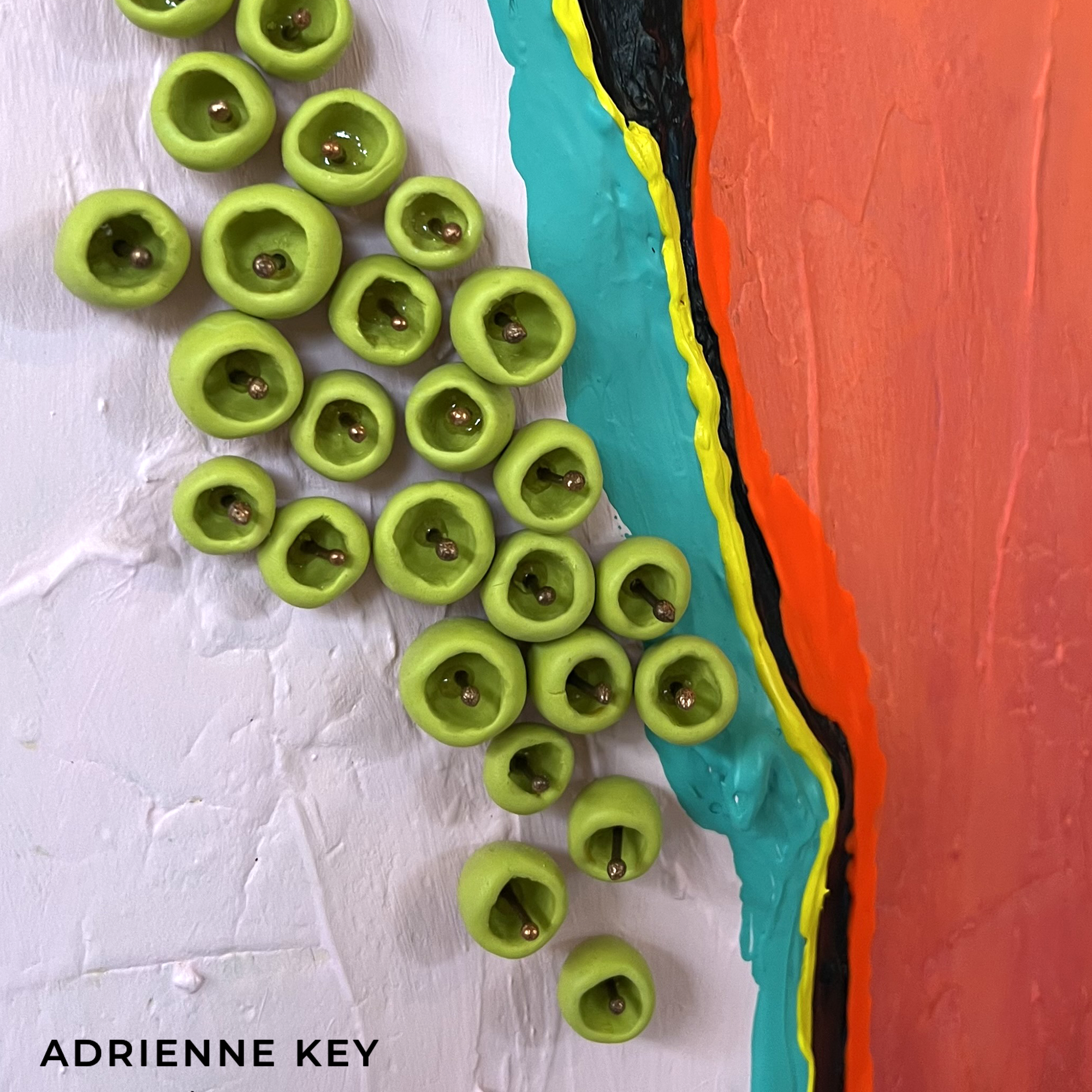 Colorful detail photo of a large 12x8 foot indoor sculpted abstract mural