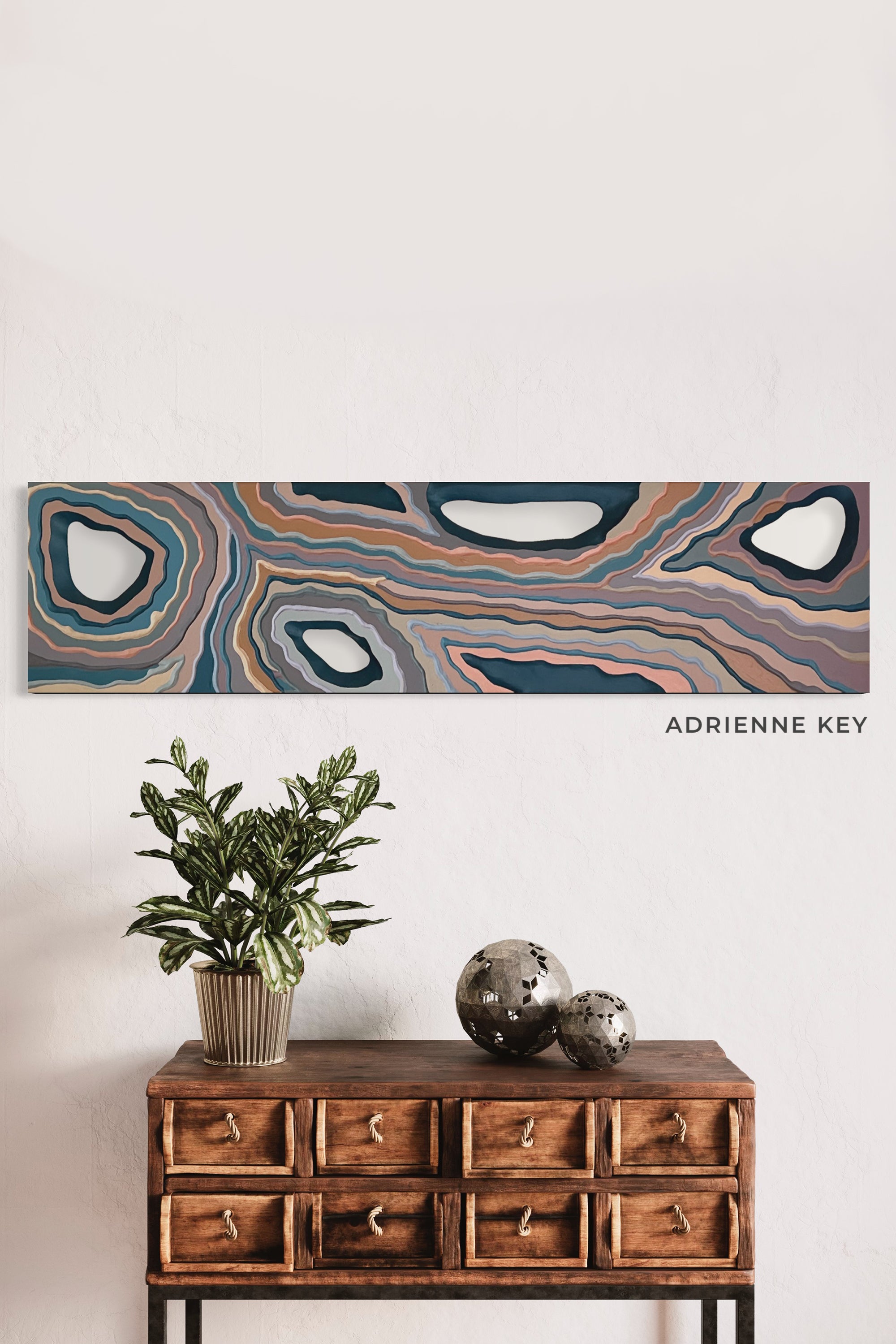48x12 inch original art poplar wood carving wall art with colorful acrylic paint hanging on the wall of a room with a small side board