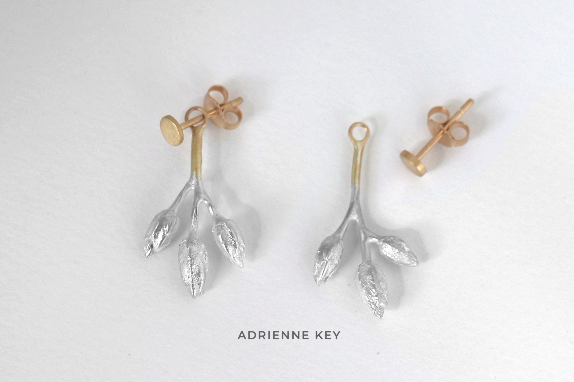 Cast sterling silver seed pod earring jackets with 14k yellow gold details and accompanying post earrings and