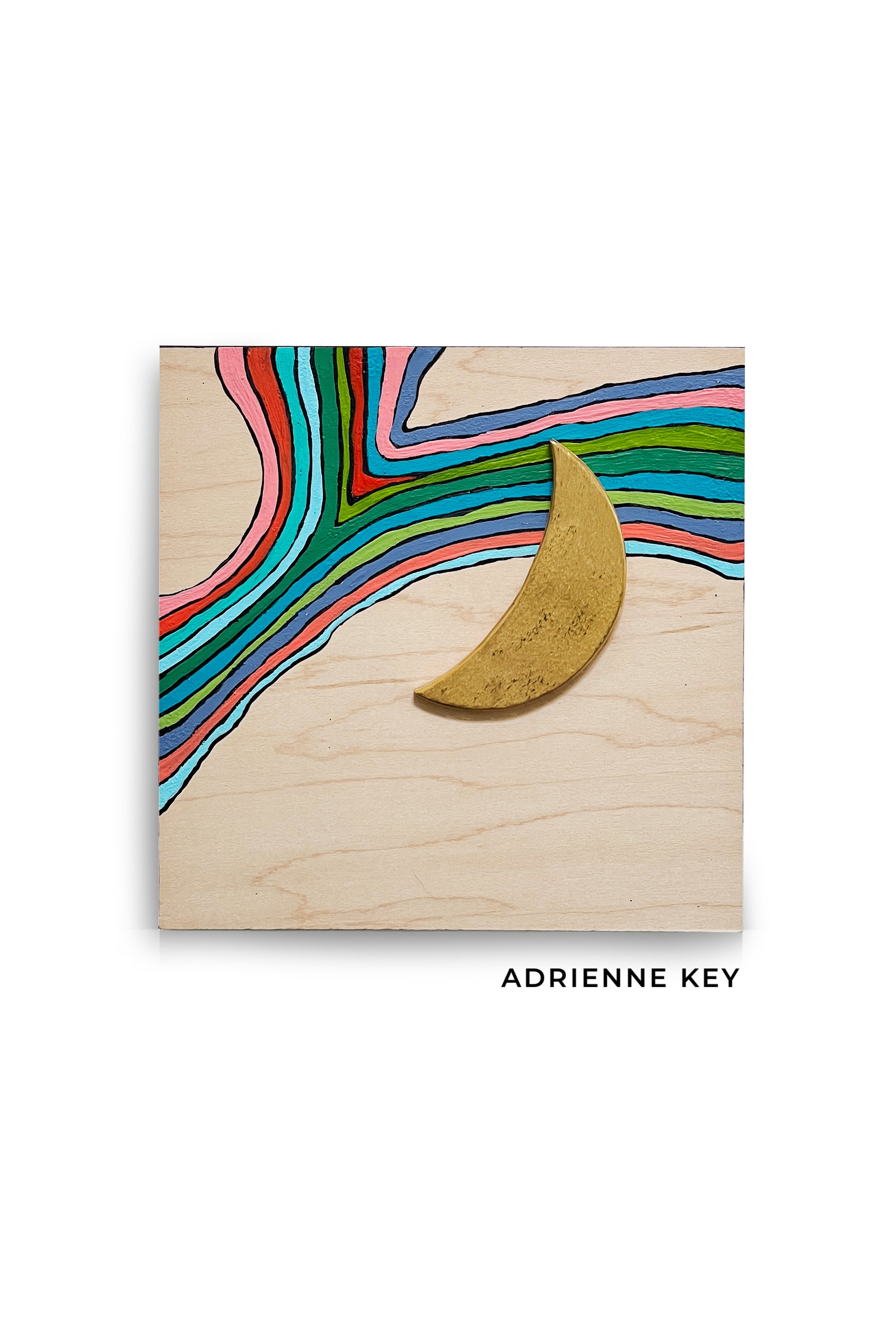 6x6 inch wall art with a natural wood base and painted, colorful concentric lines and a brass crescent moon