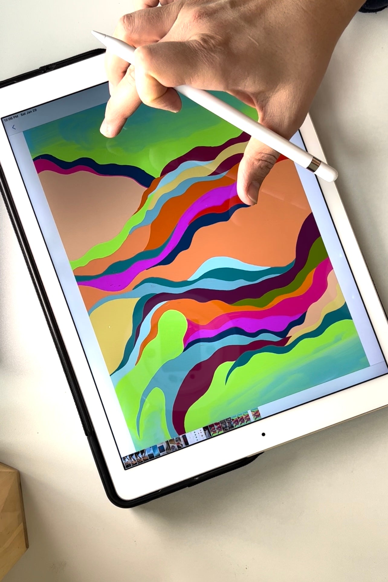 Drawing abstract vibrant color waves pattern on an iPad for an art commission 