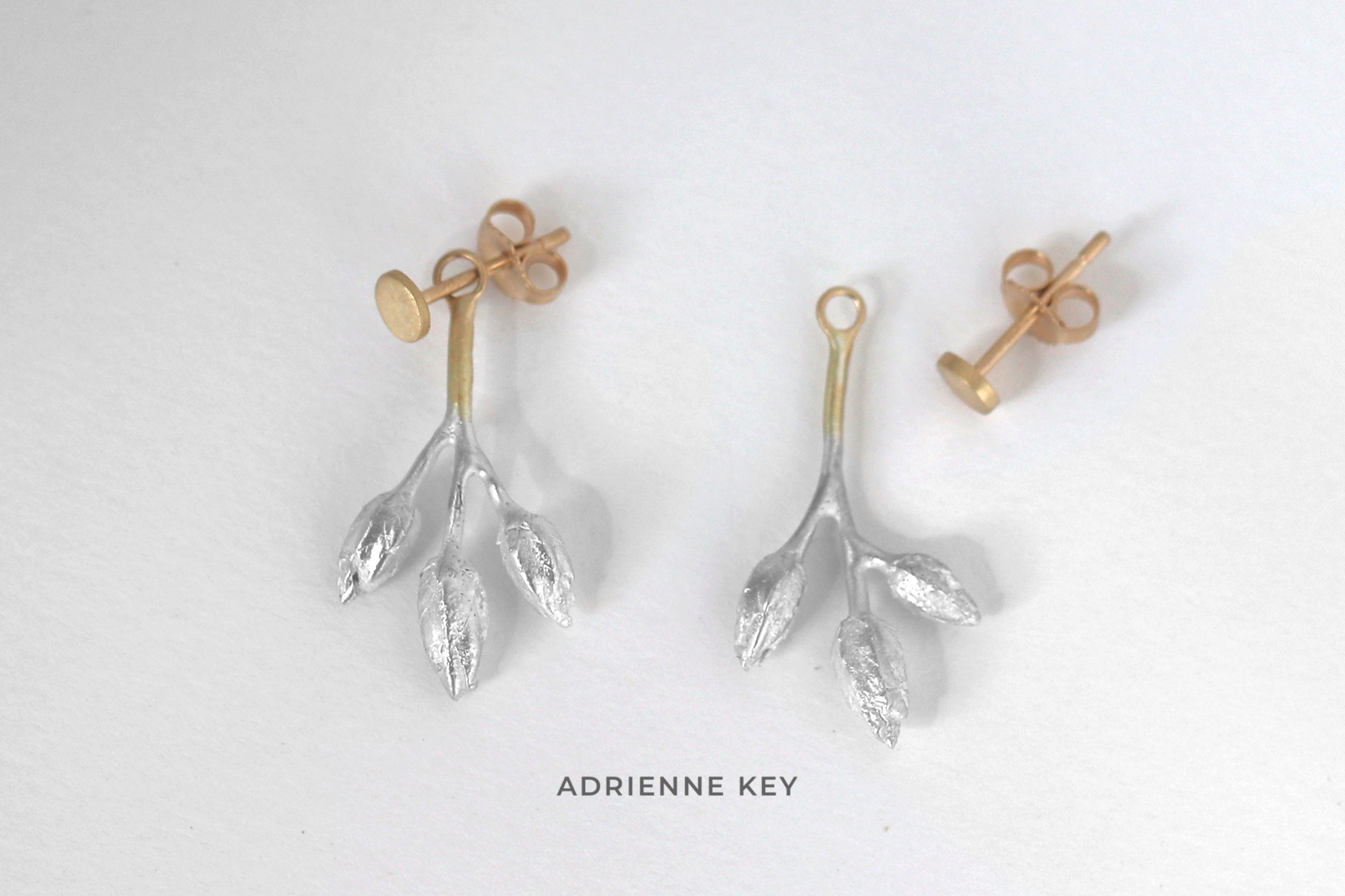 Cast sterling silver seed pod earring jackets with 14k yellow gold details and accompanying post earrings and 