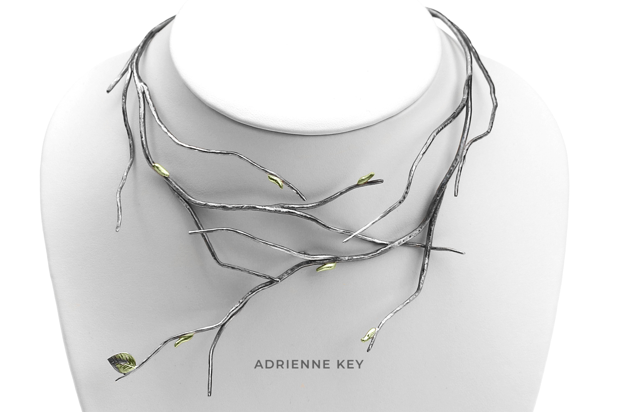 Hand fabricated blackened silver branches necklace collar with 14k green gold leaves