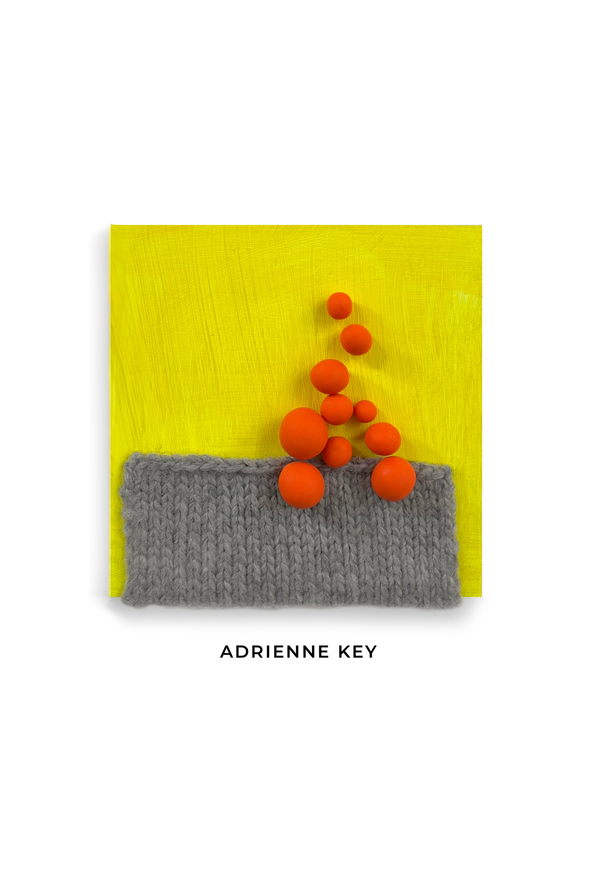 Original 4x4 inch mixed media art on a bright yellow wood base, knit grey wool, and orange polymer clay balls